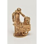 A 9CT GOLD CHARM, yellow gold kinetic charm of a man at a cart, hallmarked 9ct London, approximate