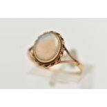 A 9CT GOLD OPAL RING, designed with an opal cabochon, in a milgrain collet setting, to a rope