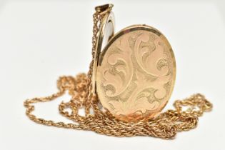 A 9CT GOLD LOCKET PENDANT, yellow gold oval locket embossed with a foliage pattern, approximate