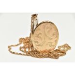 A 9CT GOLD LOCKET PENDANT, yellow gold oval locket embossed with a foliage pattern, approximate