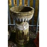 A WEATHERED COMPOSITE CAMPAGNA GARDEN URN, on a separate reeded pillar, diameter 55cm x height