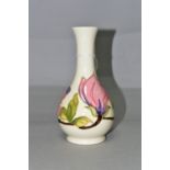 A MOORCROFT POTTERY MAGNOLIA VASE, of bottle form, decorated with tube lined pink Magnolia pattern