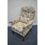 A FLORAL UPHOLSTRED ARMCHAIR