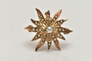 A CULTURED PEARL AND SEED PEARL STAR BROOCH PENDANT, set with a central cultured pearl, claw set