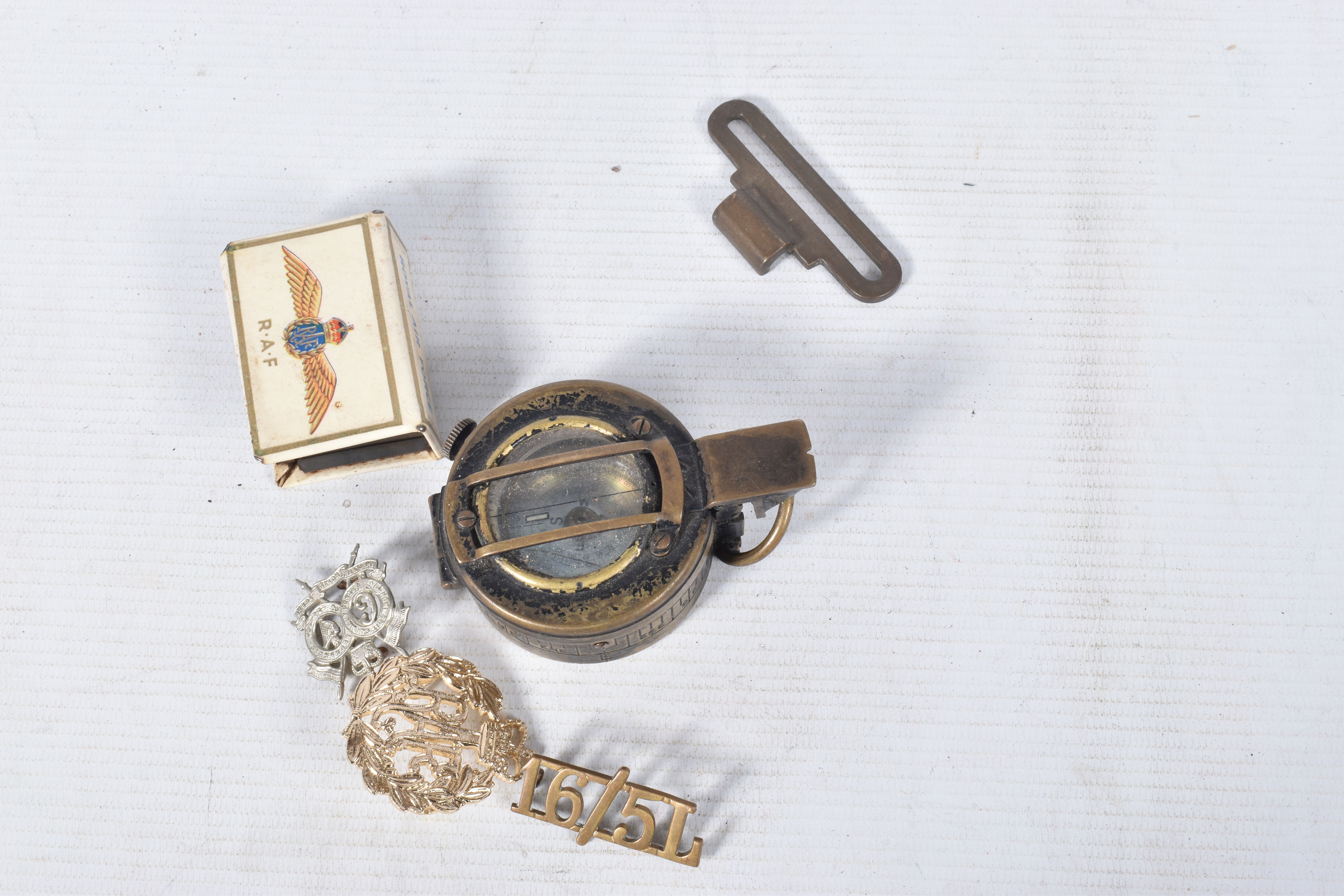 A BOX OF MIXED MILITARIA, to include a WWII compass, WWI trench art, gas masks, buttons, badges, - Image 14 of 24