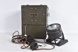 A SIGNAL CORPS FREQUENCY METER BC-221-AH, displayed as a camo green case with fold out compartments,