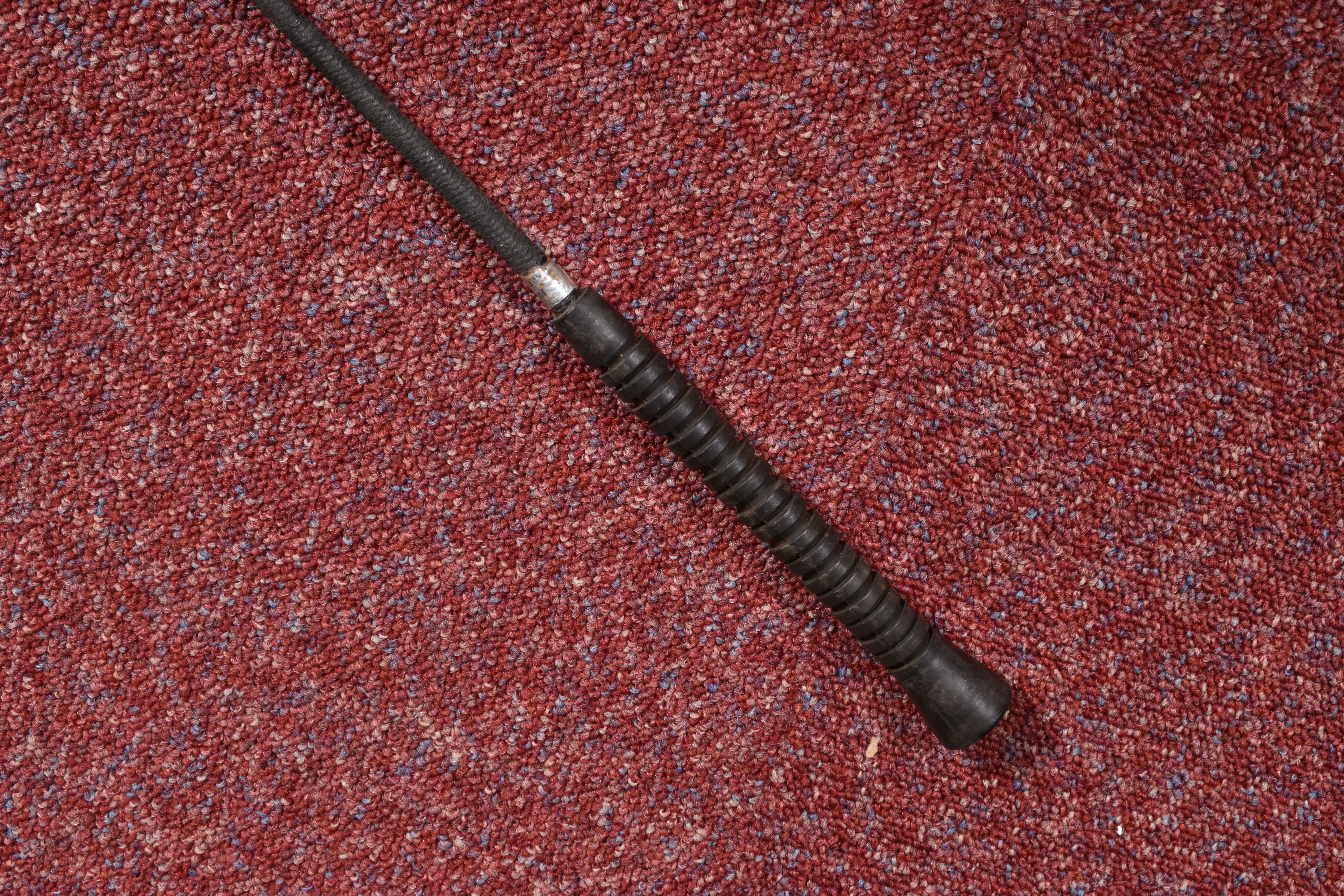 A SELECTION OF WAKLING STICKS AND RIDING CROPS, to include a black walking stick with a dented and - Image 9 of 9