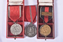 THREE GERMAN MEDALS, to include a Sudetenland medal, Anschluss Commemorative medal and an eastern