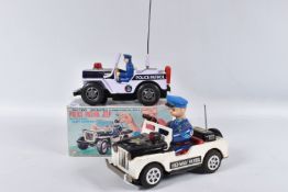 A BOXED NOMURA TN TOYS BATTERY OPERATED TINPLATE STICK SHIFT POLICE JEEP, No.7507, not tested,