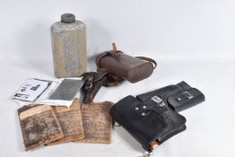 A BOX OF ASSORTED MILITARY ITEMS, to include two leather holsters to carry an East German flare