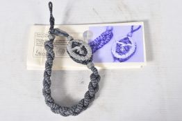 A GERMAN WWII ERA LUFTWAFFE SHOOTING LANYARD WITH ONE ACORN, the Luftwaffe marks Manship was