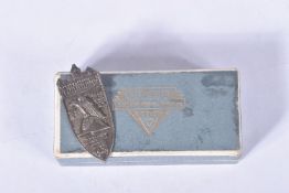 A GERMAN NSDAP 1929 NUREMBURG SILVER SHIELD WITH PIN, this is the hollow back version and comes in a