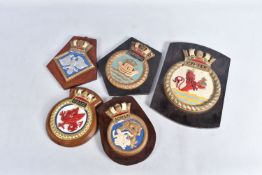 FIVE ROYAL NAVAL PERIOD SHIPS CRESTS ALL MOUNTED ON WOODEN HANGING PLINTHS, wood and plaster