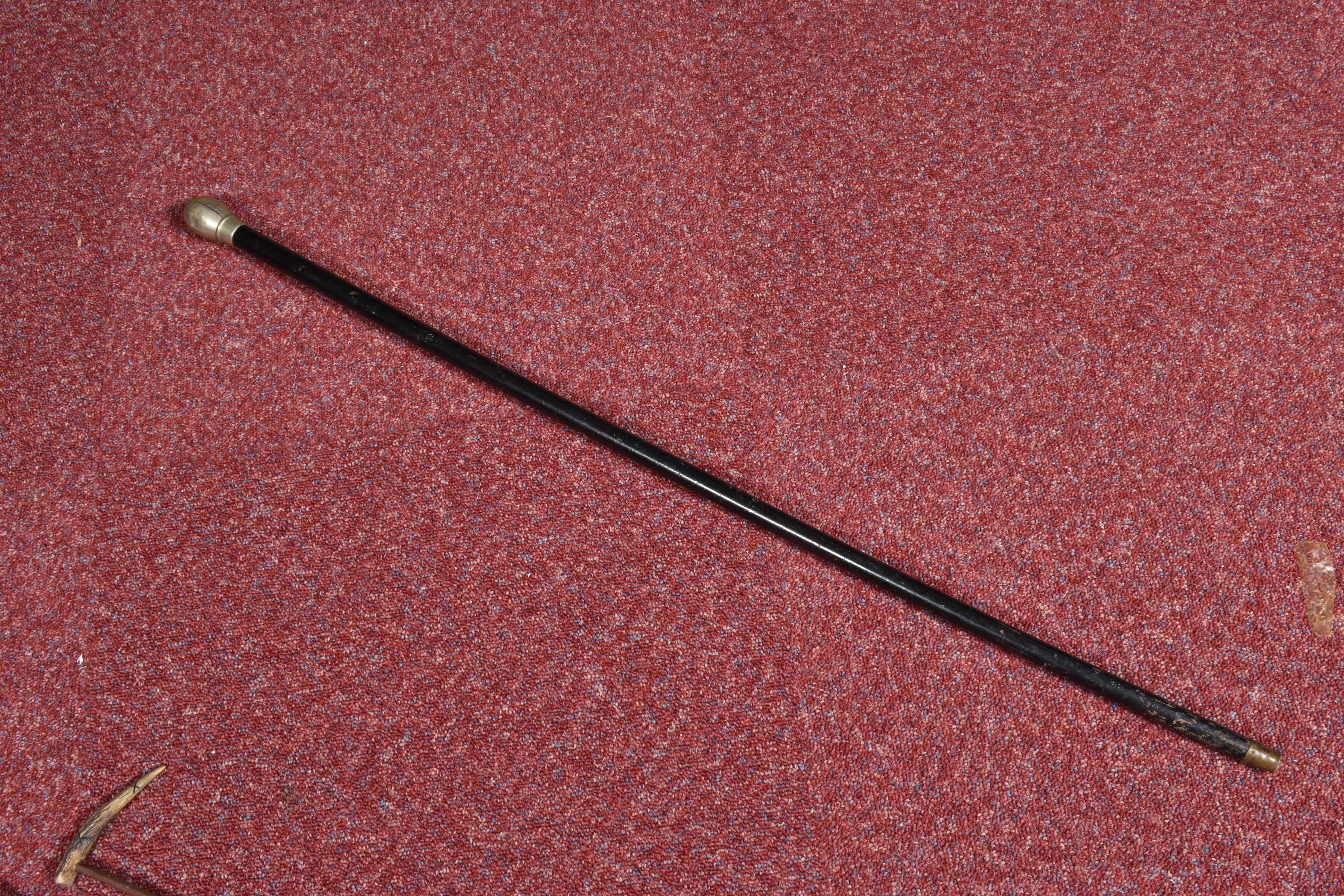 A SELECTION OF WAKLING STICKS AND RIDING CROPS, to include a black walking stick with a dented and - Image 3 of 9