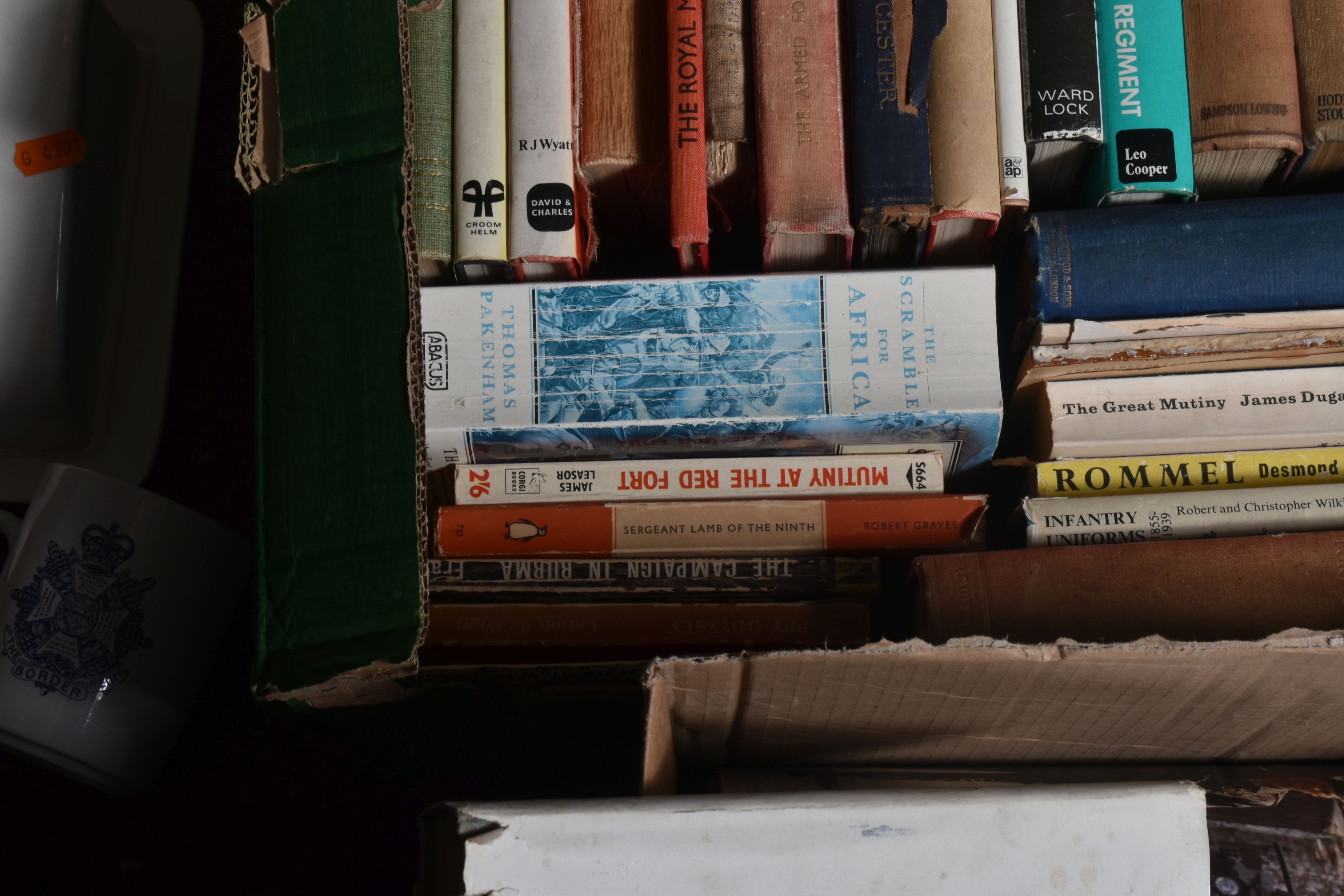 TWO BOXES OF BOOKS AND OTHER MILITARY RELATED ITEMS, to include a border regiment mug, a butter or - Image 7 of 9