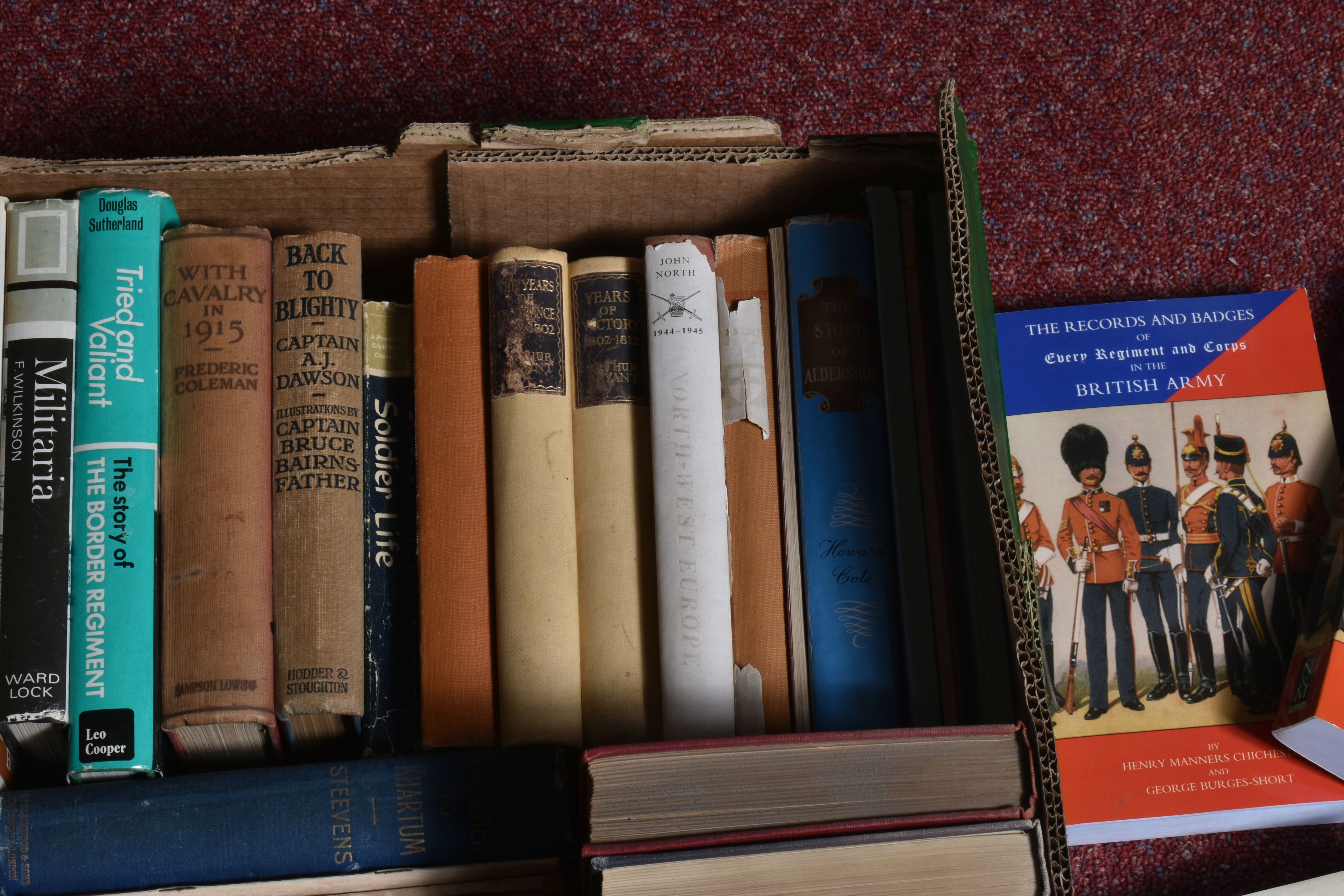 TWO BOXES OF BOOKS AND OTHER MILITARY RELATED ITEMS, to include a border regiment mug, a butter or - Image 9 of 9