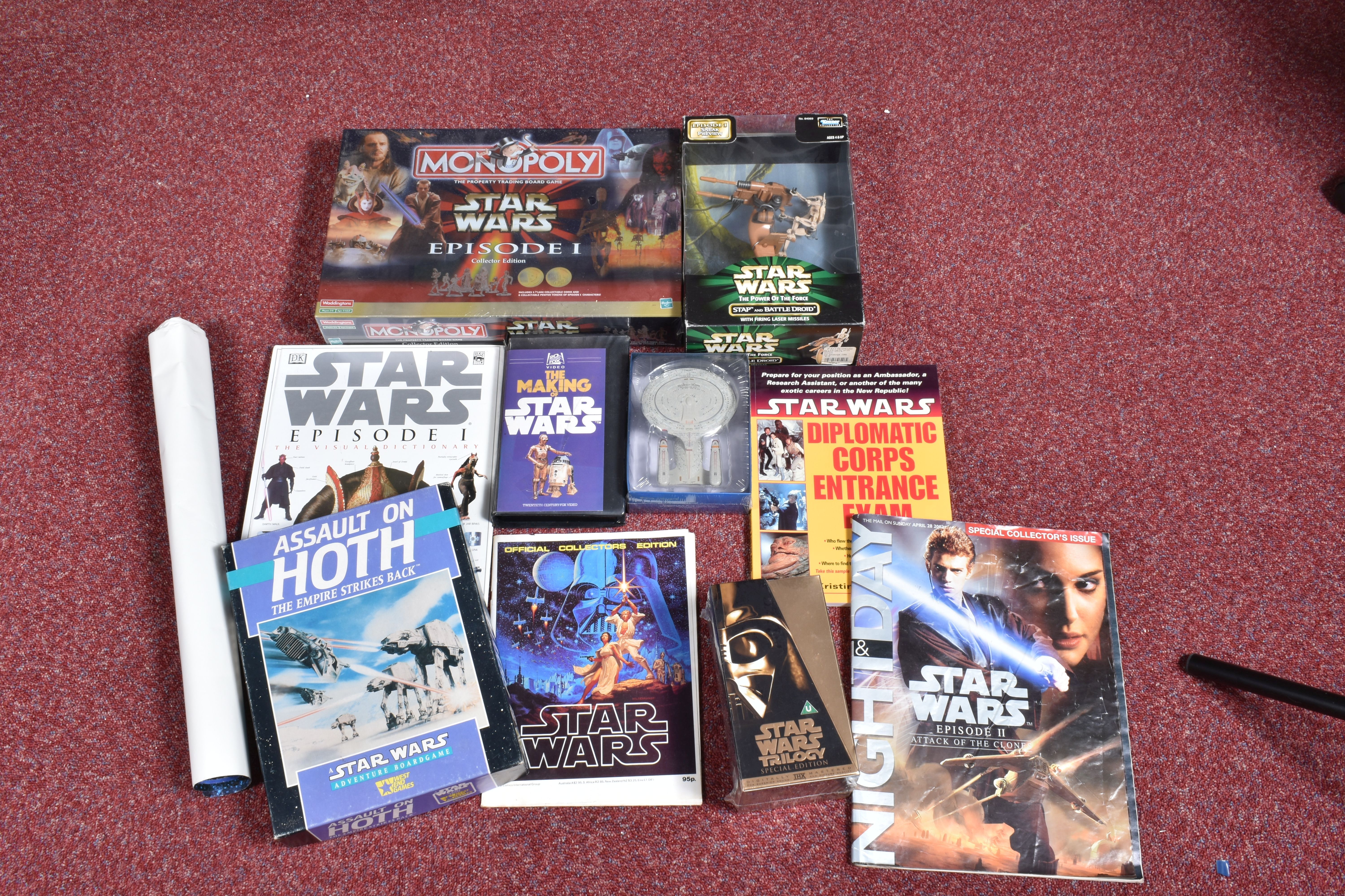 A COLLECTION OF STAR WARS COLLECTABLES, VHS, FIGURES AND GAMES, to include a sealed Star wars