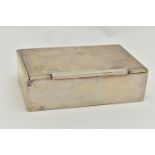 A WHITE METAL CIGARETTE BOX, of a rectangular form, polished design, wooden interior, stamped to the