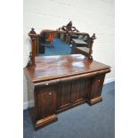 A VICTORIAN MAHOGANY MIRRORBACK SIDEBOARD, with a carved frame back, three drawers, over four