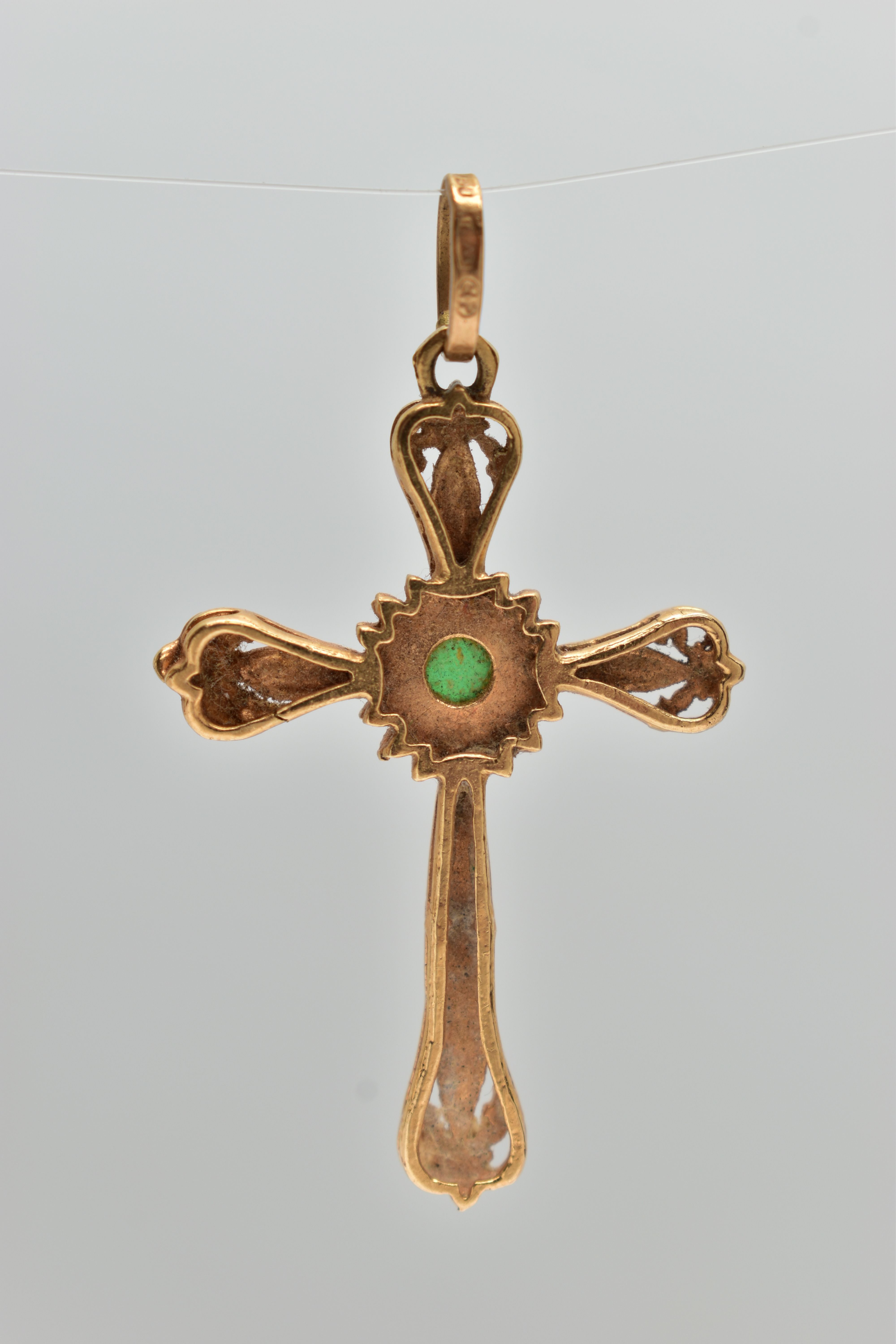 A YELLOW METAL ENAMEL CROSS PENDANT, scroll detailed cross with red enamel, to the centre is a - Image 3 of 3