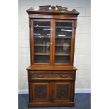 A LATE 19TH/EARLY 20TH CENTURY WALNUT SECRETAIRE BOOKCASE, the top with two glazed doors, over a