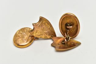 A PAIR OF EARLY 20TH CENTURY 9CT GOLD CUFFLINKS, each cufflink designed with an oval and a shield