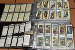 TWO ALBUMS OF CIGARETTE CARDS containing approximately 1245 cards in complete sets and part sets