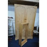 A LARGE PINE TWO DOOR WARDROBE, width 129cm x depth 53cm x height 240cm (condition:-cornice