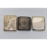 THREE SILVER CIGARETTE CASES, two with engine turned patterns and engraved cartouches, fitted with