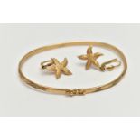 A 9CT GOLD BANGLE AND A PAIR OF EARRINGS, the thin bangle decorated with a floral pattern,