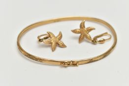 A 9CT GOLD BANGLE AND A PAIR OF EARRINGS, the thin bangle decorated with a floral pattern,