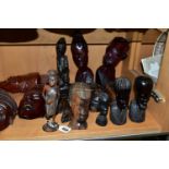 A COLLECTION OF CARVED HARDWOOD ORIENTAL AND TRIBAL WALL MASKS BUSTS AND FIGURINES, comprising seven