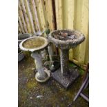 TWO COMPOSITE BIRD BATHS one in the form of a standing small child holding a circular bowl height