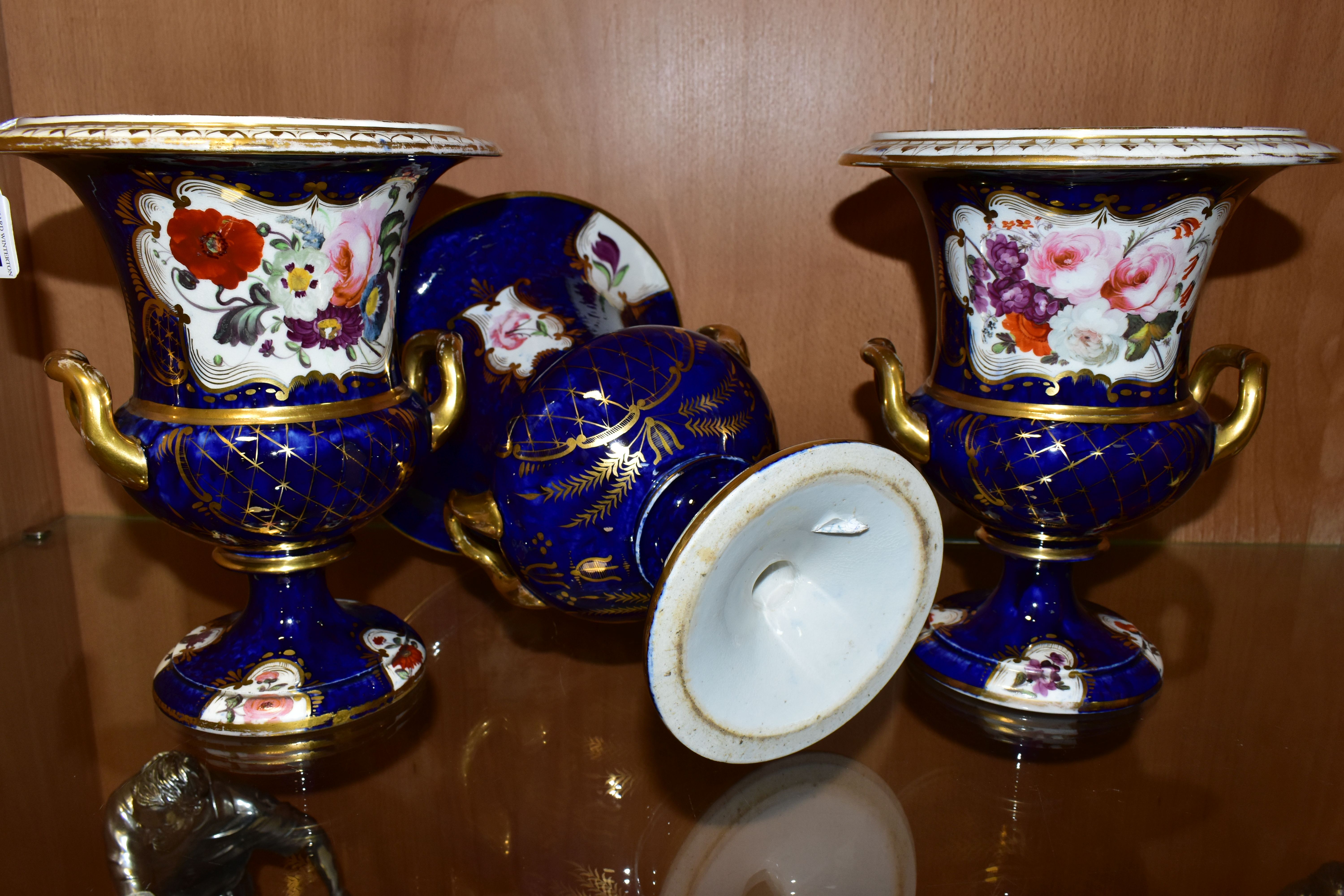 THREE VICTORIAN PORCELAIN TWIN HANDLED URNS, hand painted with panels of flowers on a fish scale - Image 8 of 8