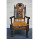 A LATE 19TH/ EARLY 20TH CENTURY CARVED OAK WAINSCOT CHAIR, the arched top depicting