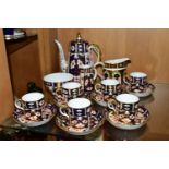 A ROYAL CROWN DERBY TRADITIONAL IMARI 2451 COFFEE SET AND AN OLD IMARI 1128 CREAM JUG, the coffee