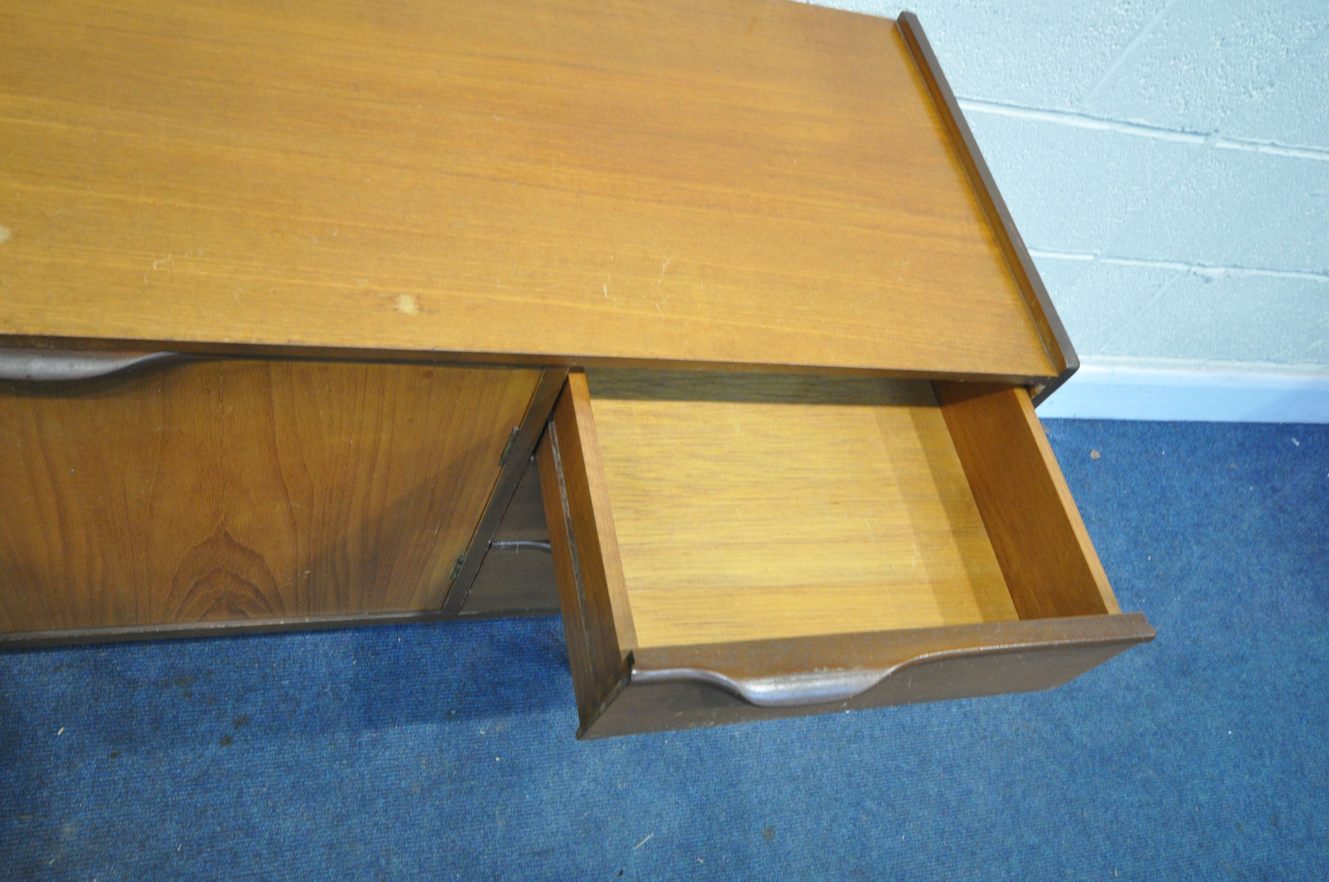 A MID CENTURY TEAK SIDEBOARD, with three cupboard doors and three drawers, on square tapering - Image 6 of 6