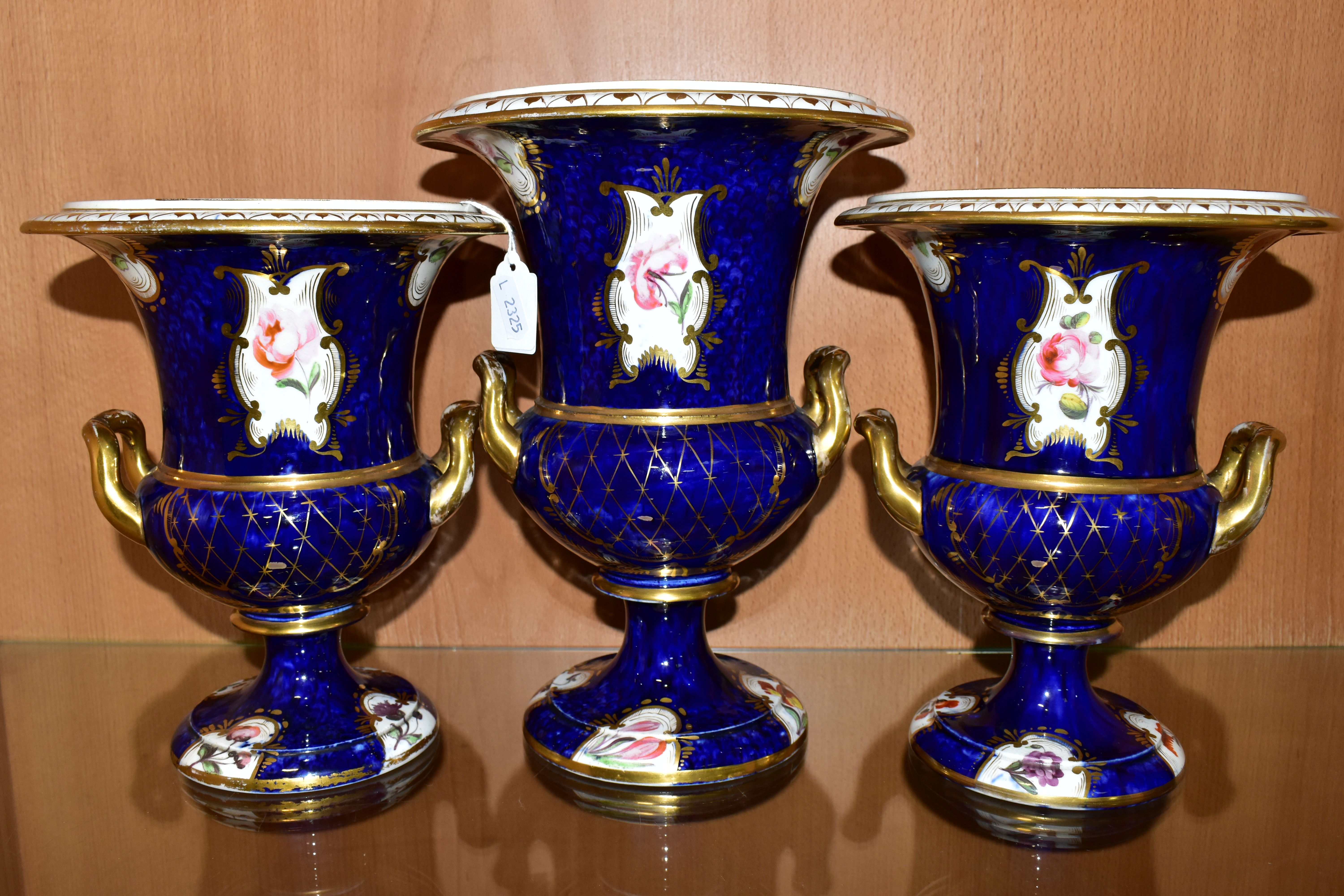 THREE VICTORIAN PORCELAIN TWIN HANDLED URNS, hand painted with panels of flowers on a fish scale - Image 3 of 8