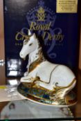 A BOXED ROYAL CROWN DERBY 'UNICORN' PAPERWEIGHT, limited edition 632/2000, with certificate,