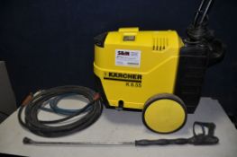 A KARCHER K8.55 PRESSURE WASHER with two hoses and a lance (not powering up so selling as spares