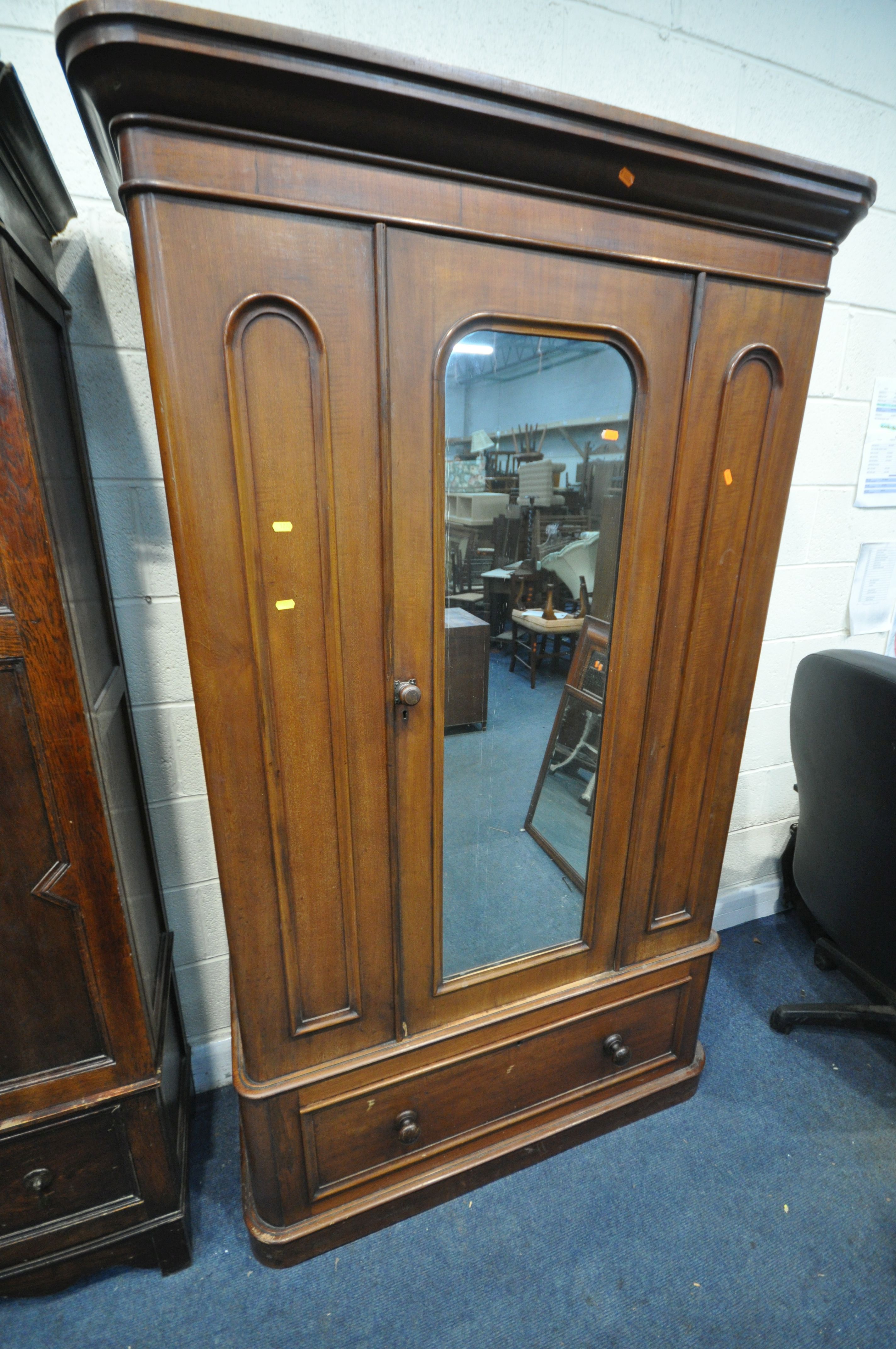 A VICTORIAN WALNUT WARDROBE, with an overhanging cornice, a single mirrored door, above a single - Image 2 of 4