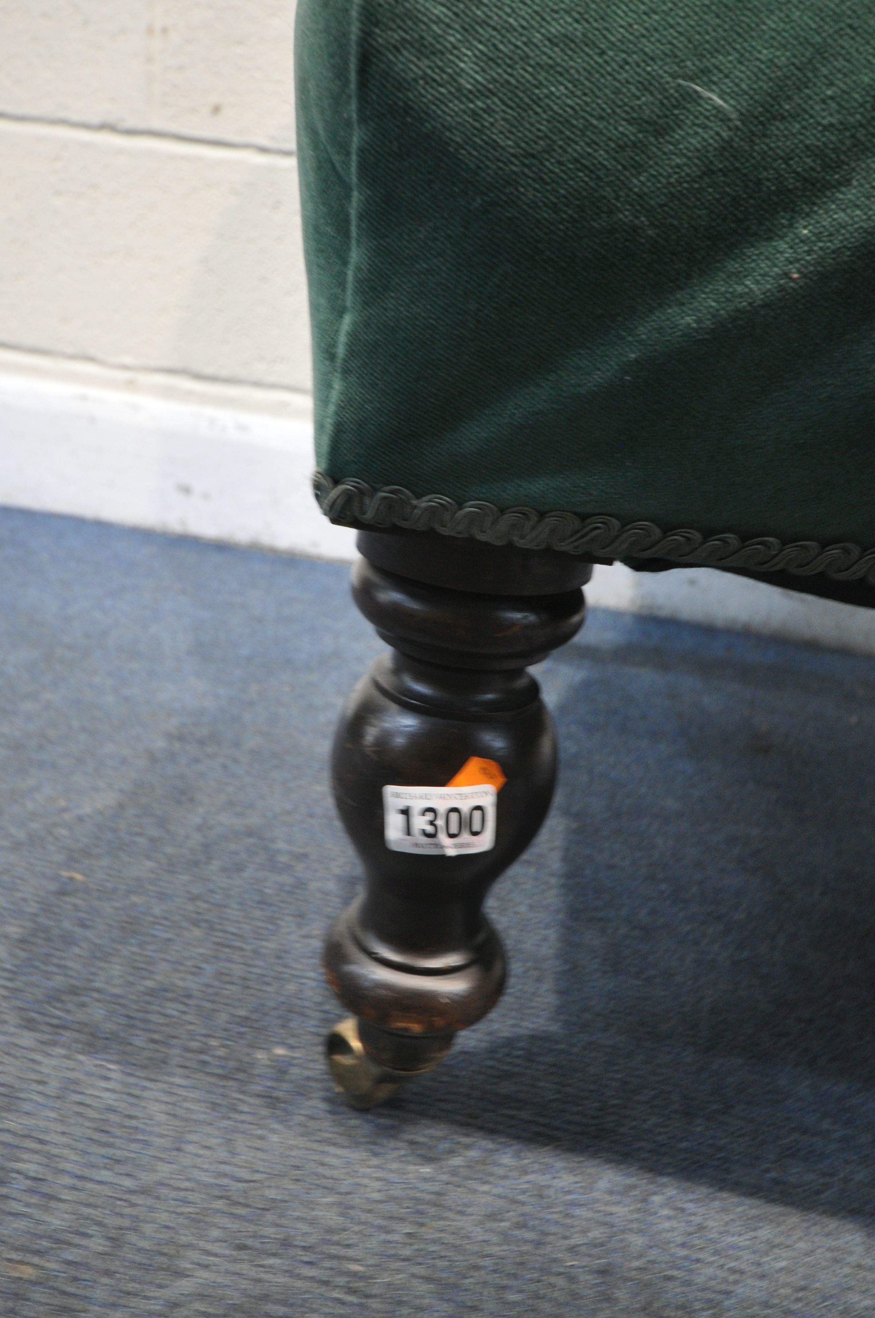 A VICTORIAN BEDROOM CHAIR, reupholstered in green buttoned fabric, on turned front legs and brass - Image 3 of 3