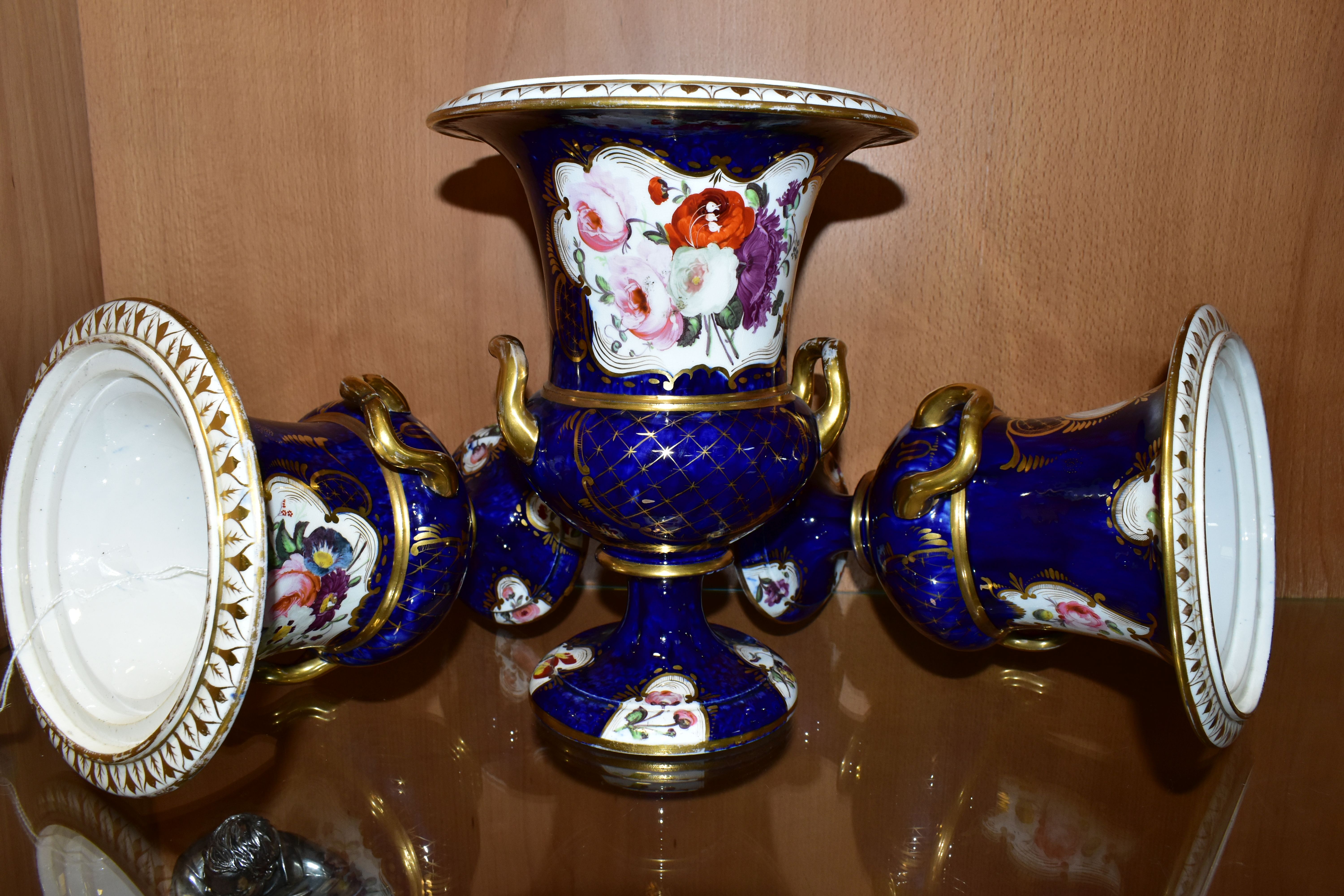 THREE VICTORIAN PORCELAIN TWIN HANDLED URNS, hand painted with panels of flowers on a fish scale - Image 6 of 8