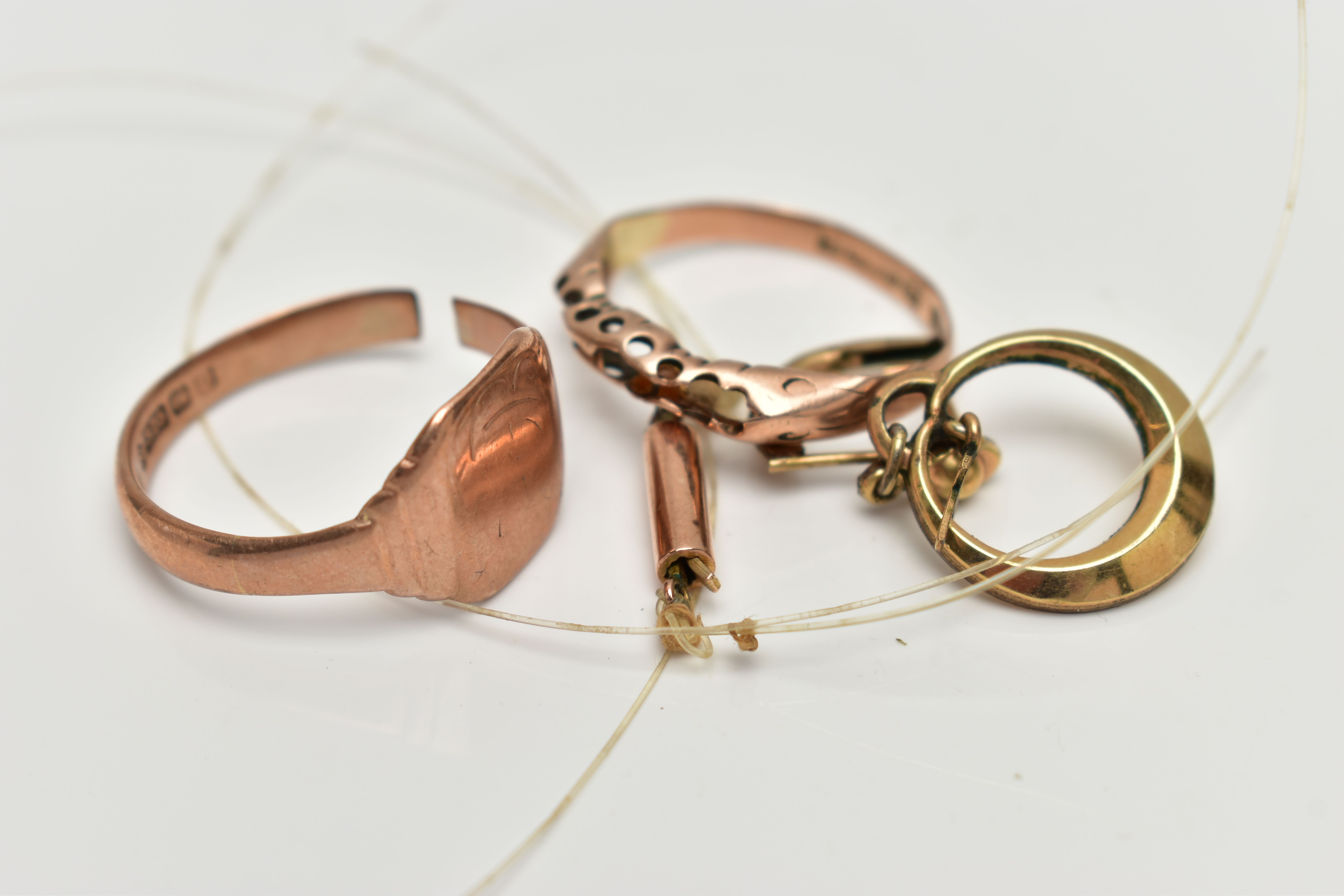 TWO 9CT GOLD RINGS, AN EARRING AND A CLASP, the first an a/f rose gold, square signet ring, worn - Image 3 of 3