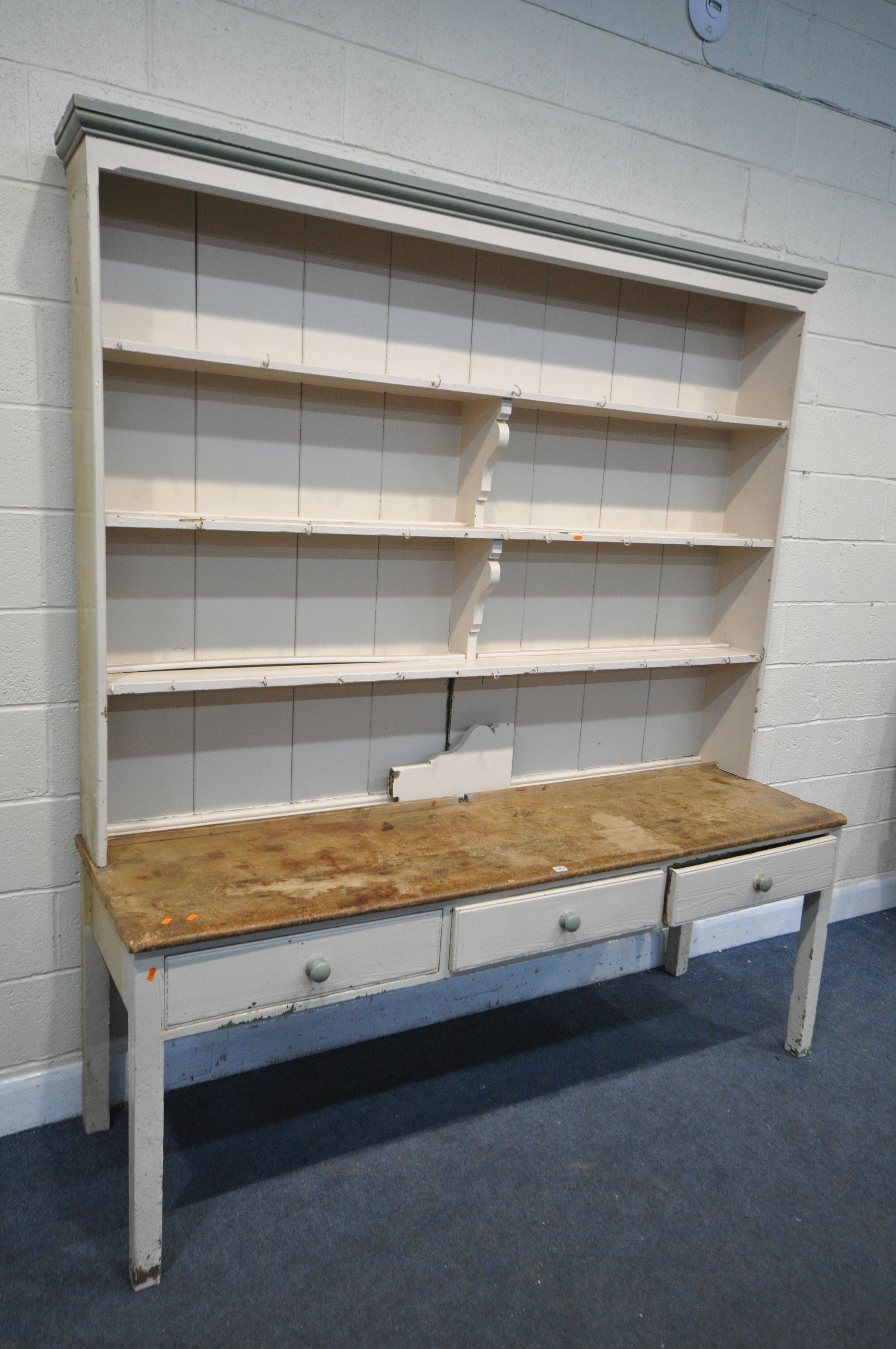 A LARGE 19TH CENTURY PAINTED PINE DRESSER, the top with triple shelves, over a base with drawers, on