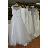 A GROUP OF EIGHT WEDDING DRESSES AND FOUR GREY BRIDESMAID DRESSES, retail stock clearance with