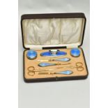 AN EARLY 20TH CENTURY CASED SILVER GUILLOCHE ENAMEL MANICURE SET, eight piece set comprising of