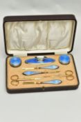 AN EARLY 20TH CENTURY CASED SILVER GUILLOCHE ENAMEL MANICURE SET, eight piece set comprising of