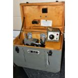 A STEREOSCOPIC TELESCOPE, made in USSR N643257in a wooden case, wired with a Mammant & Morgan Ltd