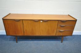 A MID CENTURY TEAK SIDEBOARD, with three cupboard doors and three drawers, on square tapering